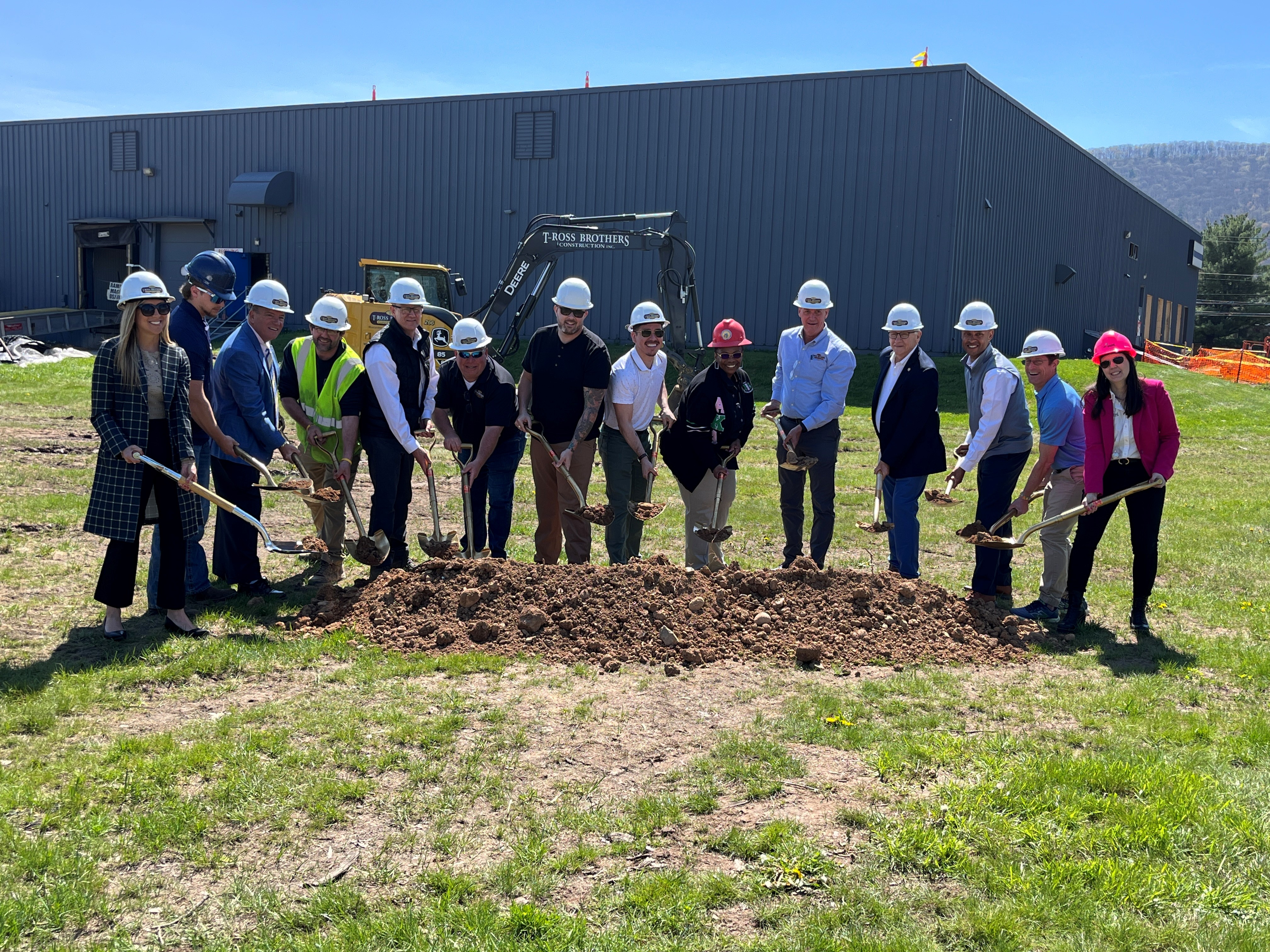 Sen. Yaw with 13 members of HBF Foods shoveling ground at their ground breaking ceremony.