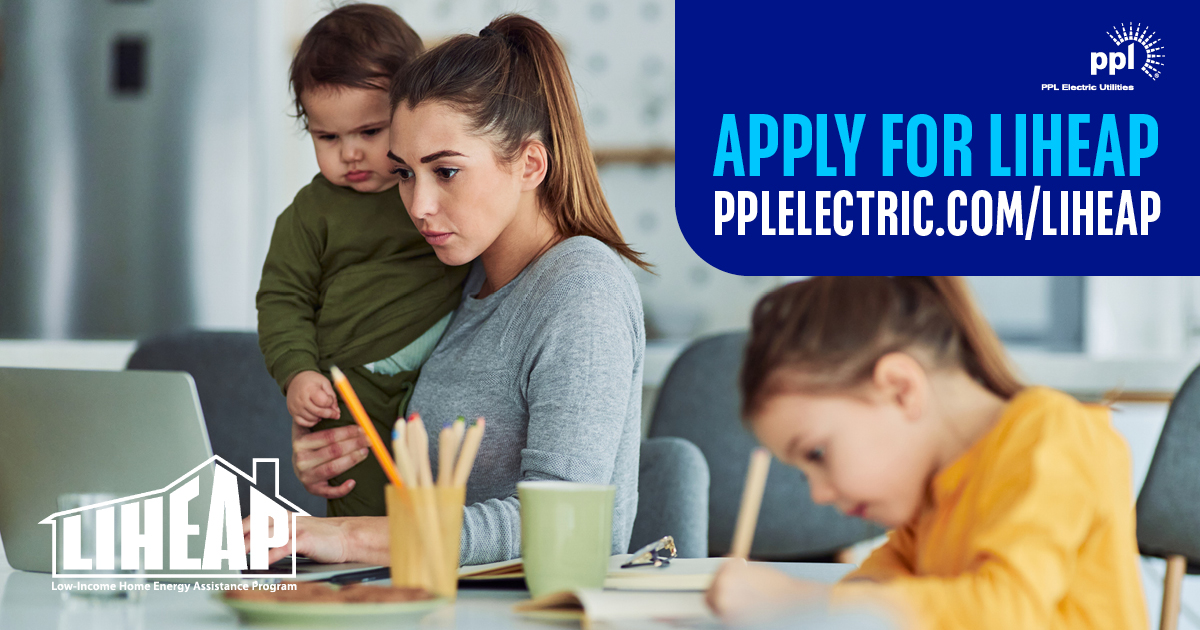 Apply for LIHEAP pplelectric.com/liheap. PPL logo in top right corner, LIHEAP logo in lower left corner. Woman holding a child while working on a computer and a second child writing on paper beside her.