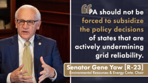 Sen. Gene Yaw sits at a conference table beside a graphic displaying a quote about Pennsylvania not being forced to subsidize other states’ energy policy decisions. The graphic includes the name and title ‘Senator Gene Yaw [R 23], Environmental Resources & Energy Cmte. Chair.
