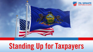 American flag flying behind the PA flag with words Standing Up for Taxpayers underneath.