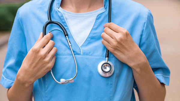 cropped image of medical student holding stethoscope on neck
