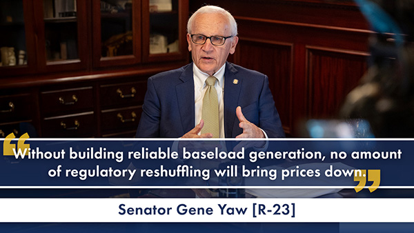 Sen. Gene Yaw sits at a desk in an office, speaking while gesturing with his hands. A quote graphic overlays the lower portion of the image, reading: “Without building reliable baseload generation, no amount of regulatory reshuffling will bring prices down.”