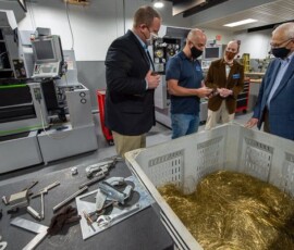 May 21, 2021 - Richard K. Hendricks (second from left), instructor of machine tool technologies/automated manufacturing, shares his insights in College Avenue Labs. Gathered around a bin of brass wire are (from left) Martin; Bradley M. Webb, dean of engineering technologies; Yaw; and Zack Moore, vice president for government and community relations at Penn State. 05/21/21
