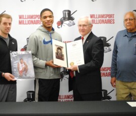 February 18, 2016 - Sen. Yaw recognizes Qayyim Ali, Williamsport Area High School high jump (AAA) state champion in 2015. From left is Cross Country Coach Jeremy Steppe, Qayyim Ali, Sen. Yaw and Track and Field Coach Sam Belle. 02/18/16