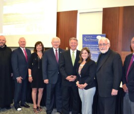 July 21, 2015 - The Center for Rural Pennsylvania (CRP) held a public hearing on July 21 at the Fred M. Rogers Center at Saint Vincent College to solicit testimony on heroin and opioid addiction treatment and recovery services. Among those participating in the program were, from left, Fr. Paul R. Taylor, O.S.B., executive vice president of Saint Vincent College; Barry Denk, director of CRP; Dr. Nancy Falvo of Clarion University, secretary of the CRP board; Senator Gene Yaw, chairman of the CRP board; Senator John Wozniak, vice chairman of the CRP board; Senator Kim Ward; Br. Norman W. Hipps, O.S.B., president of Saint Vincent College; and Representative Garth D. Everett, treasurer of the CRP board. 07/21/15